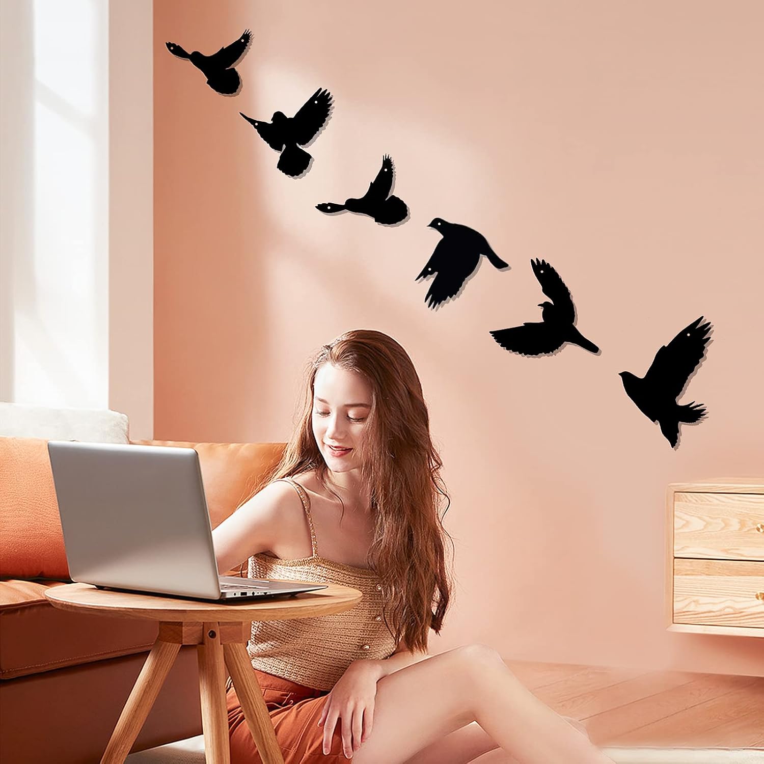 Six LZAOA black metal birds arranged in flight on a warm peach wall