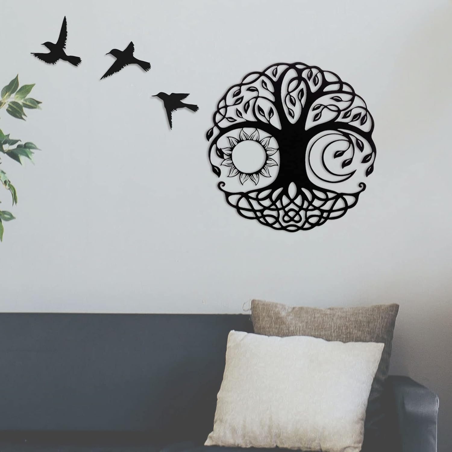 Black LZAOA Tree of Life metal wall art displayed above a sofa
